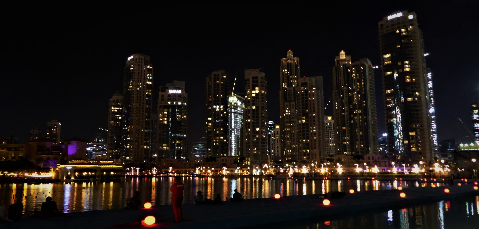 buildings lit up at night in Dubai